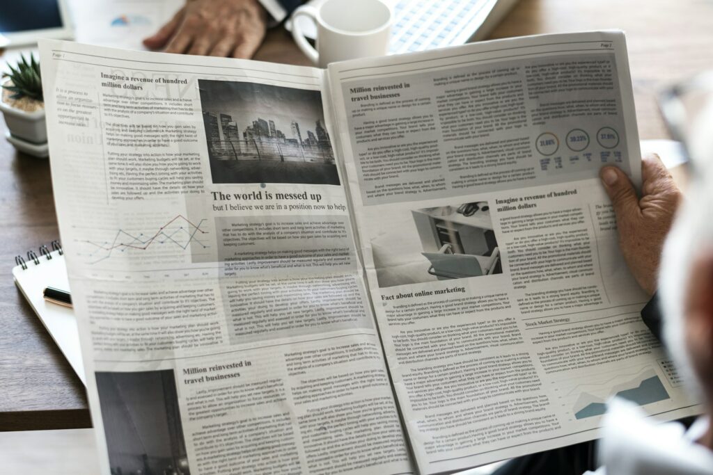Business people reading newspaper